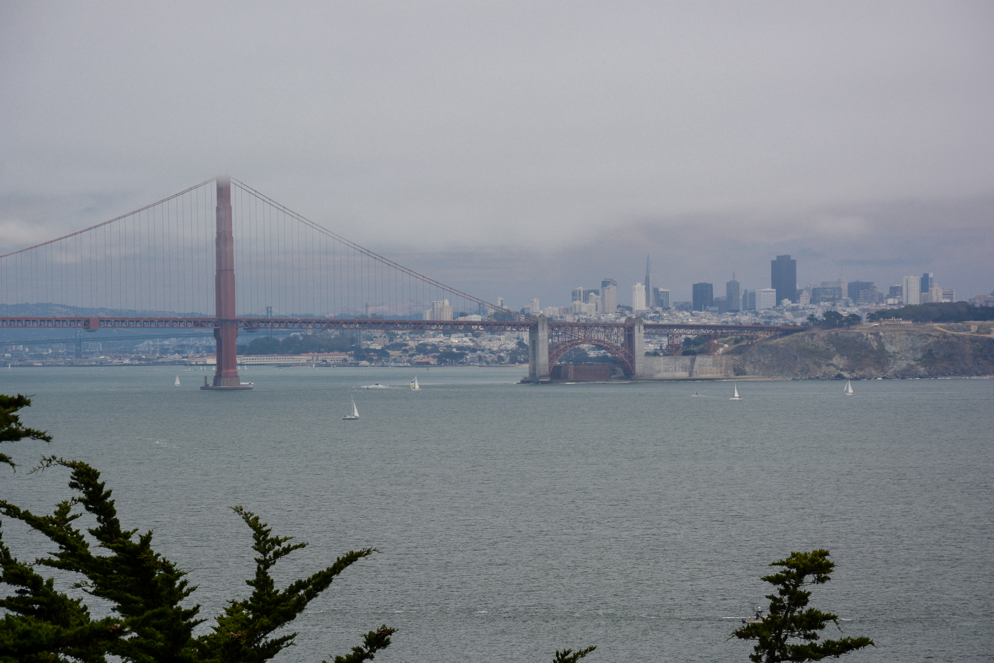 view of Golden Gate Bridge and San Francisco skyline as fog lifts