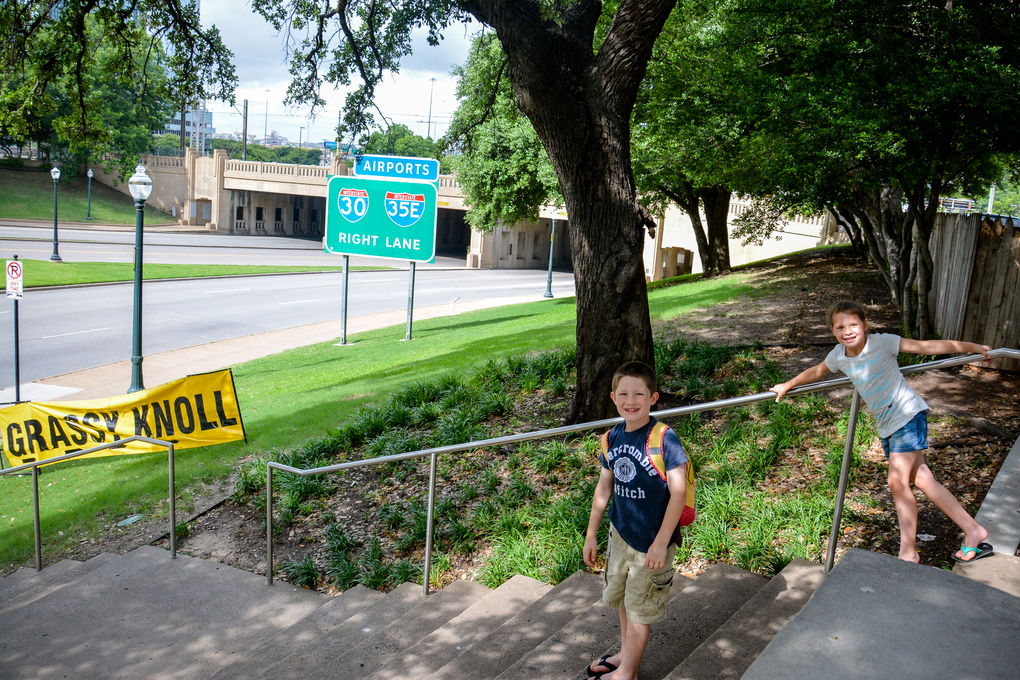 Kids next to the Grassy Knoll in Dallas TX