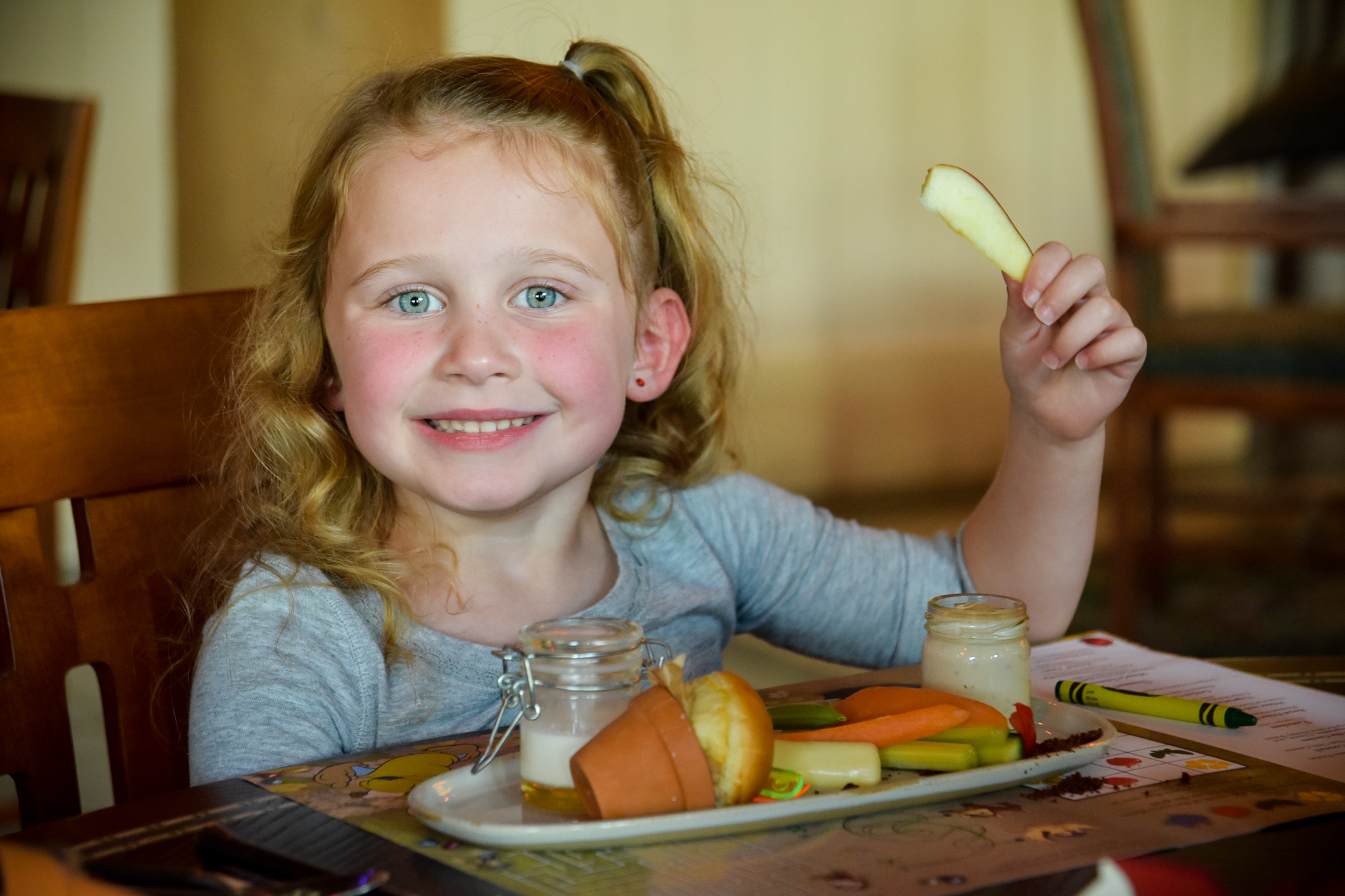 Little girl with the kids' appetizer at Storybook Dining