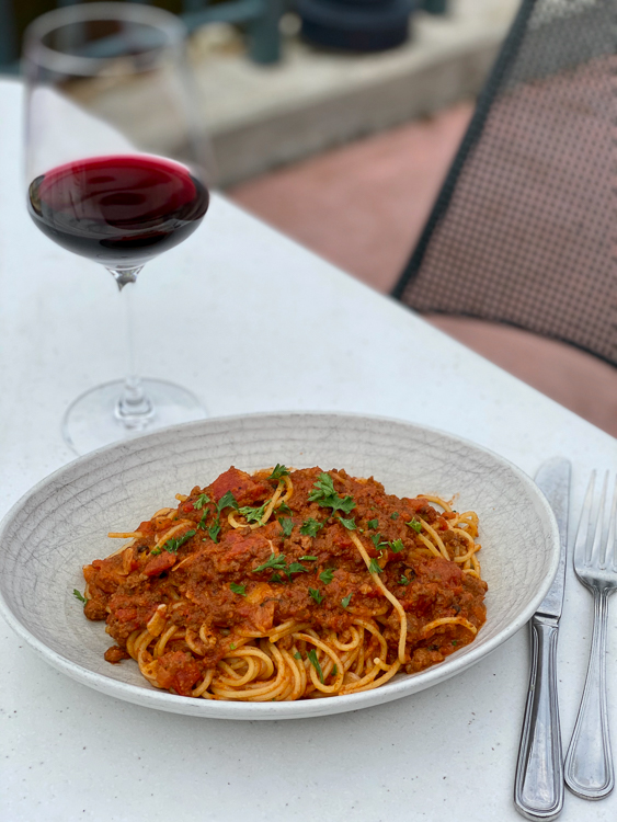 Spaghetti bolognese and a glass of red wine at Terralina