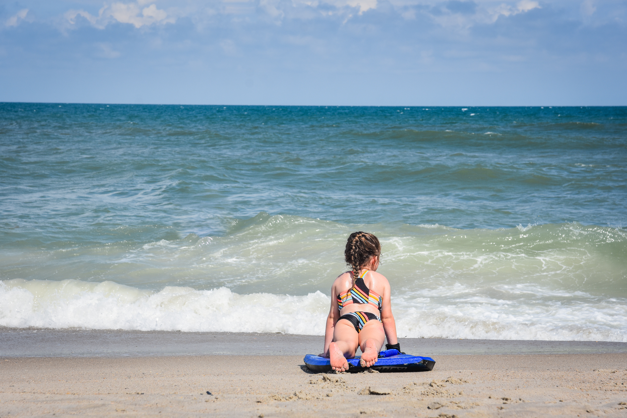 Girl doing beach yoga