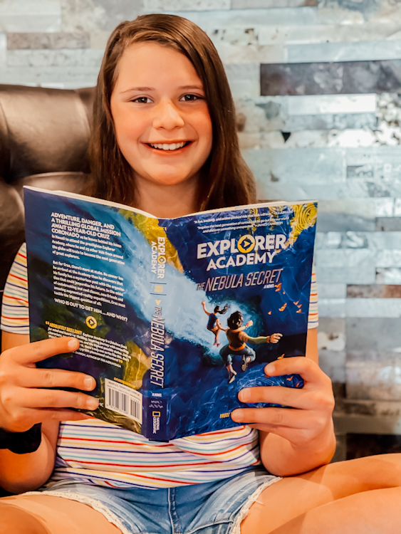 tween girl reading Explorer Academy