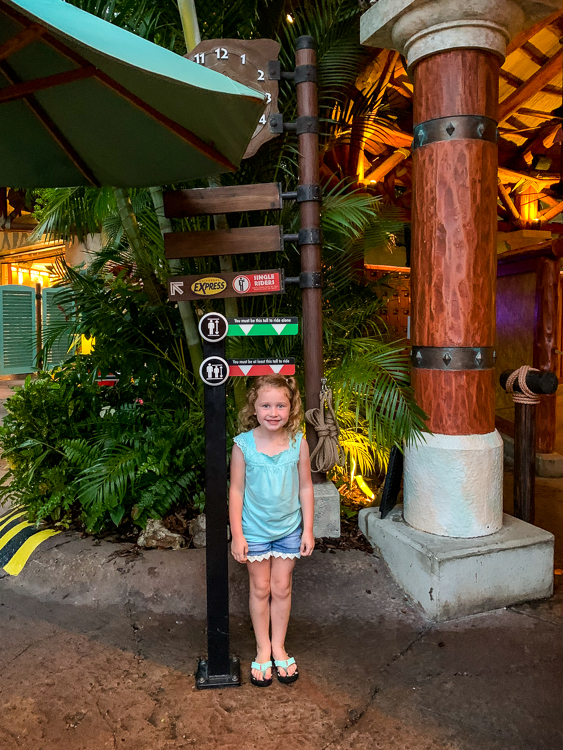 Girl checking her height at Islands of Adventure