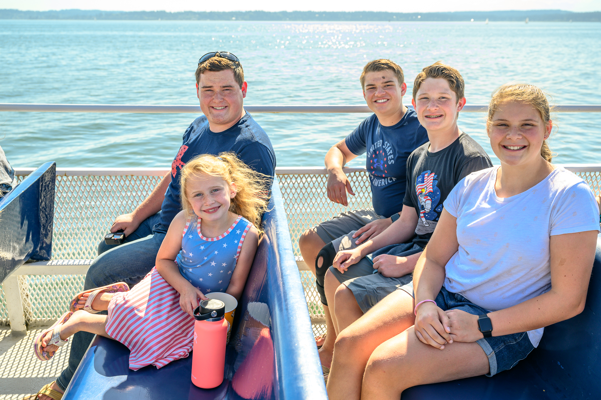 Smiling kids sailing in Puget Sound