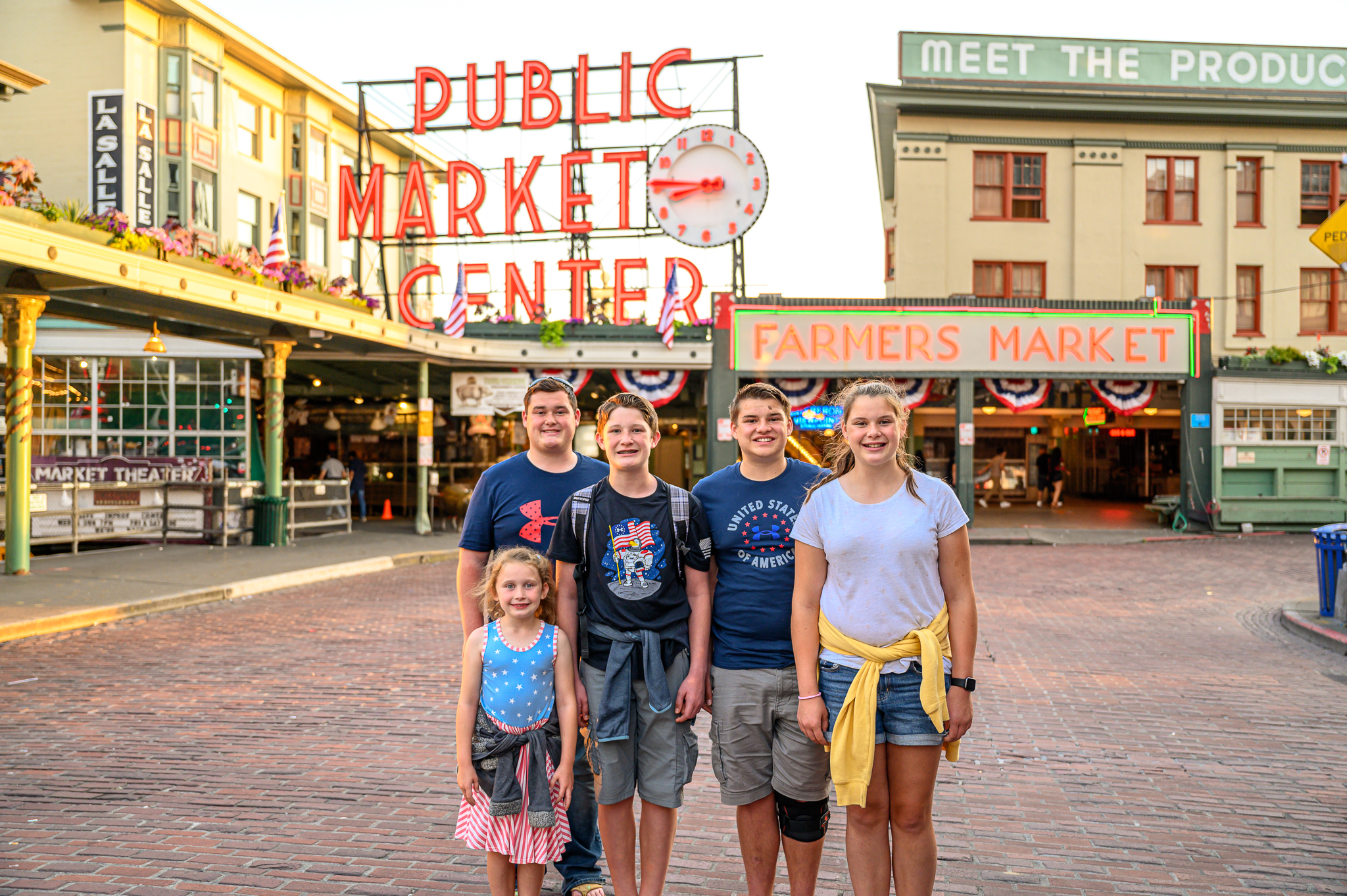Kids standing in front of Pike Place Market