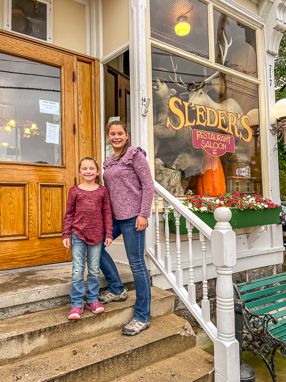 girls standing in front of Sleder's Restaurant Traverse City