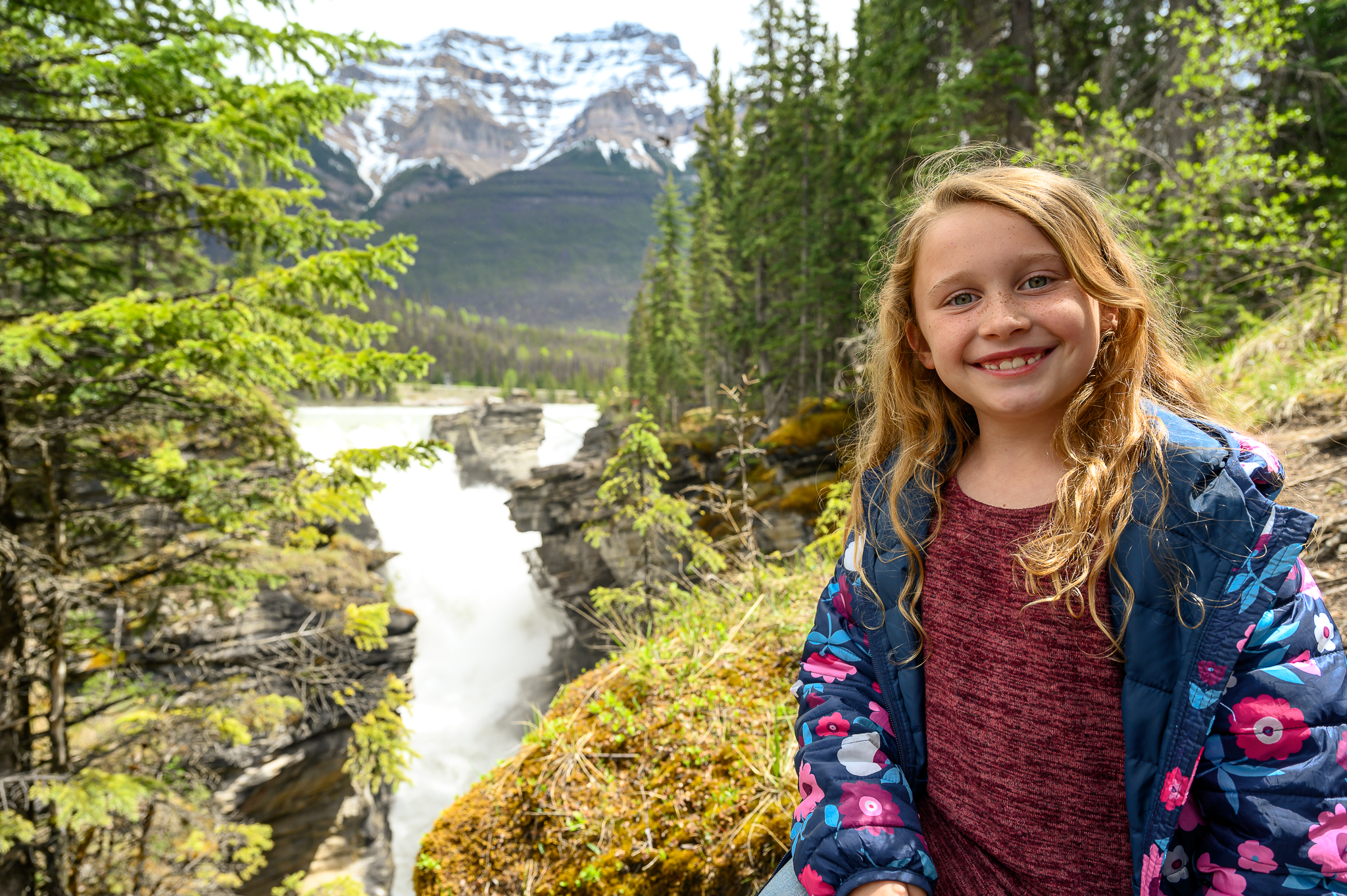 smiling girl at Athabasca Falls on Icefields Parkway