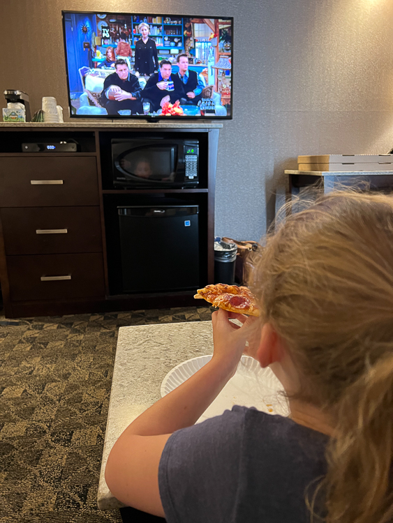 girl eating pizza at Best Western Nanaimo
