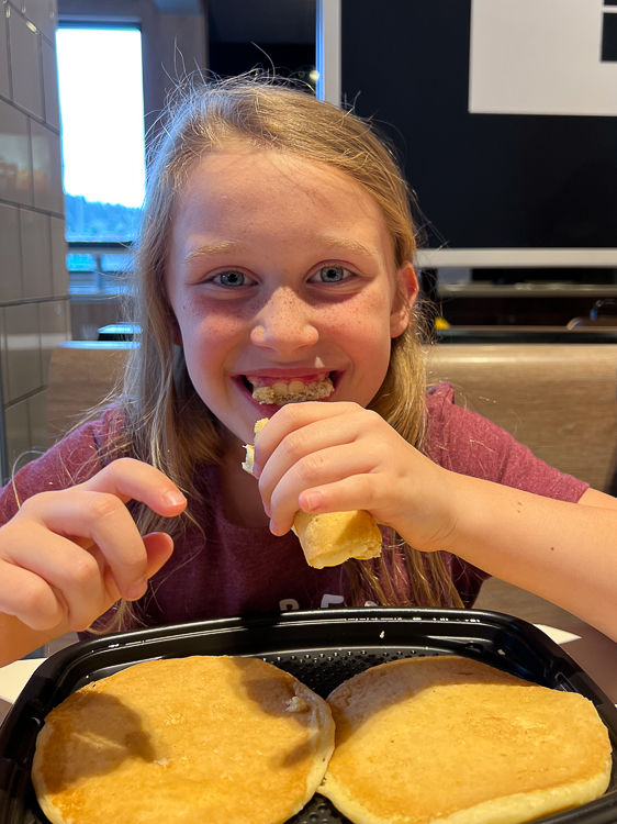 girl eating pancakes at McDonald's Kamloops